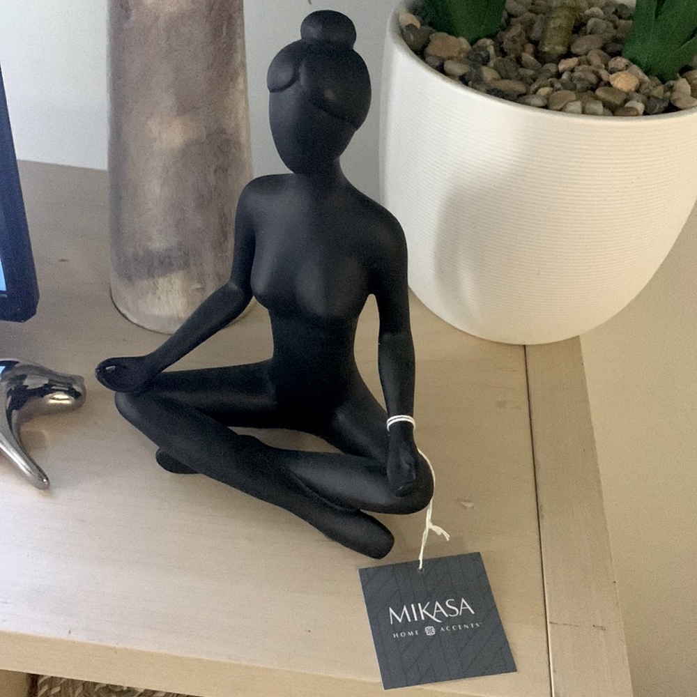 Cute statue of women meditating . She’s about 10 inches high.